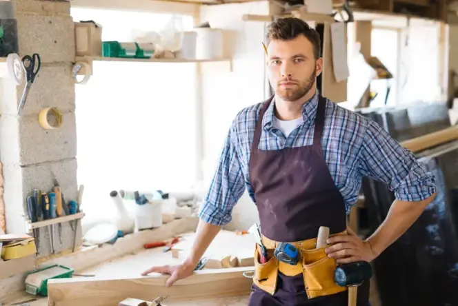 Professional carpenter handyman working in San Diego workshop