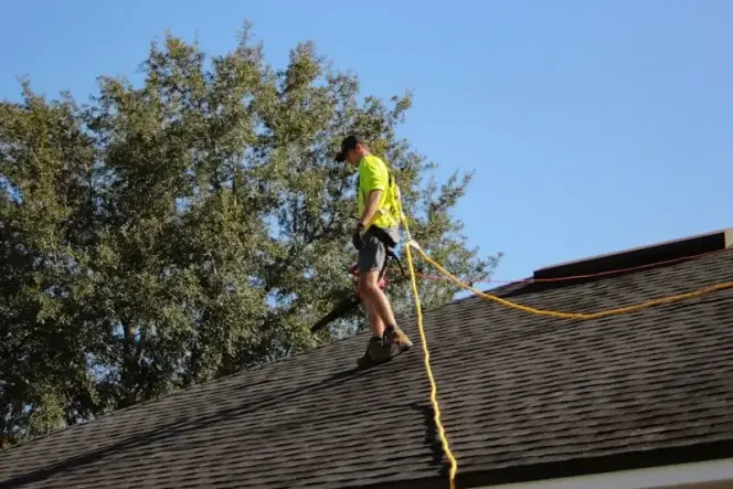 Professional roofer installing new roof in San Diego